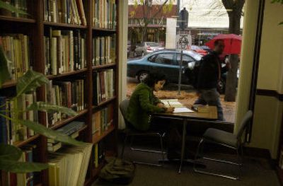 
Amanda Jones, a sophomore from Potlatch, Idaho, studies between classes in the library at New Saint Andrews College. Approximately 150 students take classes at the school in downtown Moscow, Idaho. 
 (Photos by J. BART RAYNIAK / The Spokesman-Review)