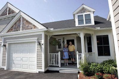 
Mary Ebens, 69, and her husband, Richard, 75, stand at their home at The Villages at Quail Run, an age-restricted housing community for people age 55 and over, in Hudson, Mass.
 (Associated Press / The Spokesman-Review)