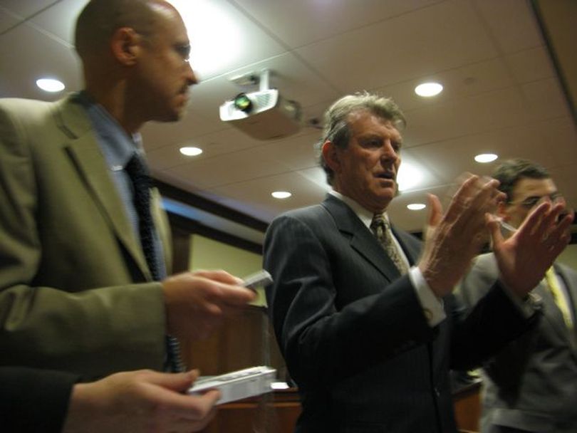 Gov. Butch Otter answers questions from reporters on Thursday. At left is reporter John Miller of the Associated Press. (Betsy Russell)