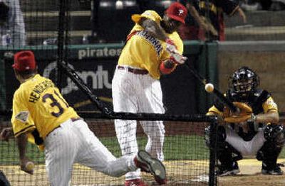 
 Ryan Howard hits a home run in the first round of Monday's home run derby.  
 (Associated Press / The Spokesman-Review)