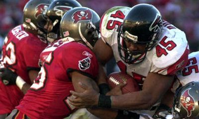 
Falcons running back T.J. Duckett (45) shares Atlanta's running load with Warrick Dunn and explosive quarterback Michael Vick.
 (File/Associated Press / The Spokesman-Review)