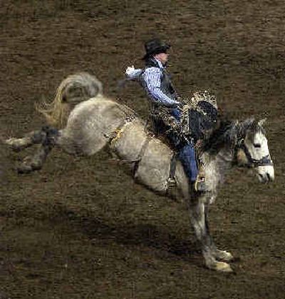 
Boe Reeverts from Browning, Mont., rides Cold Rush during Championship Saddle Bronc Riding at the Arena.  
 (Liz Kishimoto / The Spokesman-Review)