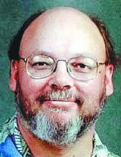 
Eastern's Paul Butorac, left, and Kenny Smith mug Washington's Mike Jensen.
 (Associated Press / The Spokesman-Review)