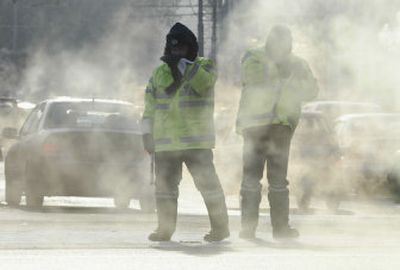 
Police braving freezing temperature control traffic Wednesday in Moscow.
 (Associated Press / The Spokesman-Review)