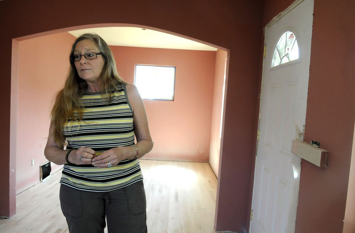 Joanne Tucker stands last week in her north Spokane home, which is being remodeled after a fire.   jesset@spokesman.com (JESSE TINSLEY jesset@spokesman.com / The Spokesman-Review)