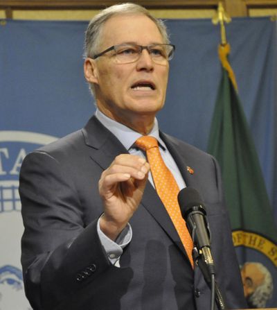 OLYMPIA -- Gov. Jay Inslee tells reporters Washington is ready to defend its system of legal marijuana and is confident in its position opposing President Trump’s restrictions on immigration during a press conference on Feb. 9, 2017. (Jim Camden / The Spokesman-Review)