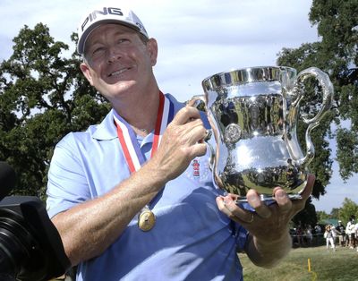 Jeff Maggert displays the trophy he received for winning the U.S. Senior Open in 2015. (Rich Pedroncelli / Associated Press)