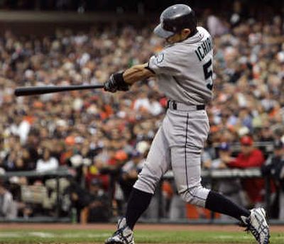 Seattle's Ichiro Suzuki connects for a two-run, inside-the-park home run in the fifth inning off Chris Young of the San Diego Padres. Associated Press
(Associated Press / The Spokesman-Review)