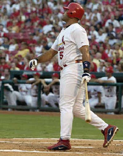 
St. Louis' Albert Pujols watches his homer sail away Tuesday, giving him 30 home runs in each of his first four years. 
 (Associated Press / The Spokesman-Review)