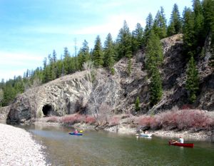 Paddlers on the Kettle River parallel an abandoned railway and tunnel proposed for a rail trail in Ferry County. Courtesy of Ferry County Rail Trail Partners (Courtesy of Ferry County Rail Trail Partners / The Spokesman-Review)
