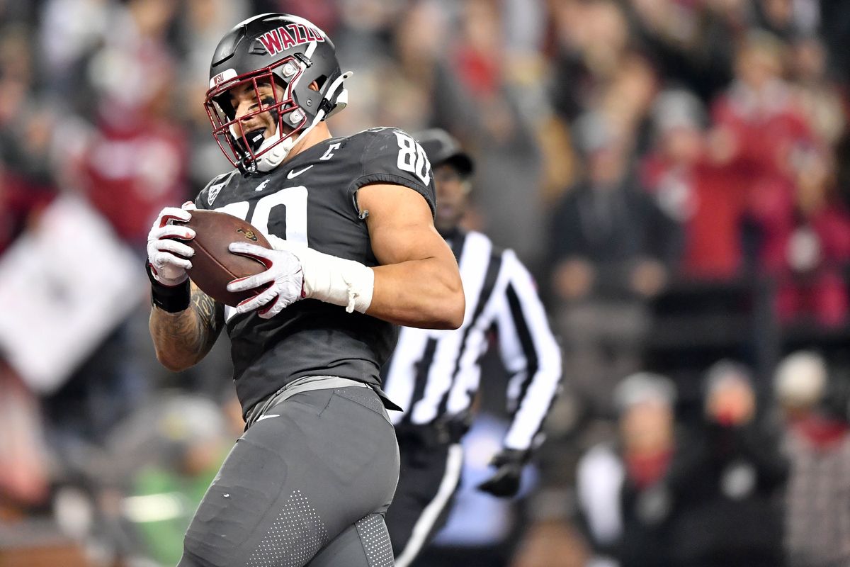 Washington State Cougars defensive end Brennan Jackson score a touchdown against Colorado on Friday at Gesa Field in Pullman. Jackson recovered two fumbles for TDs.  (Tyler Tjomsland/The Spokesman-Review)