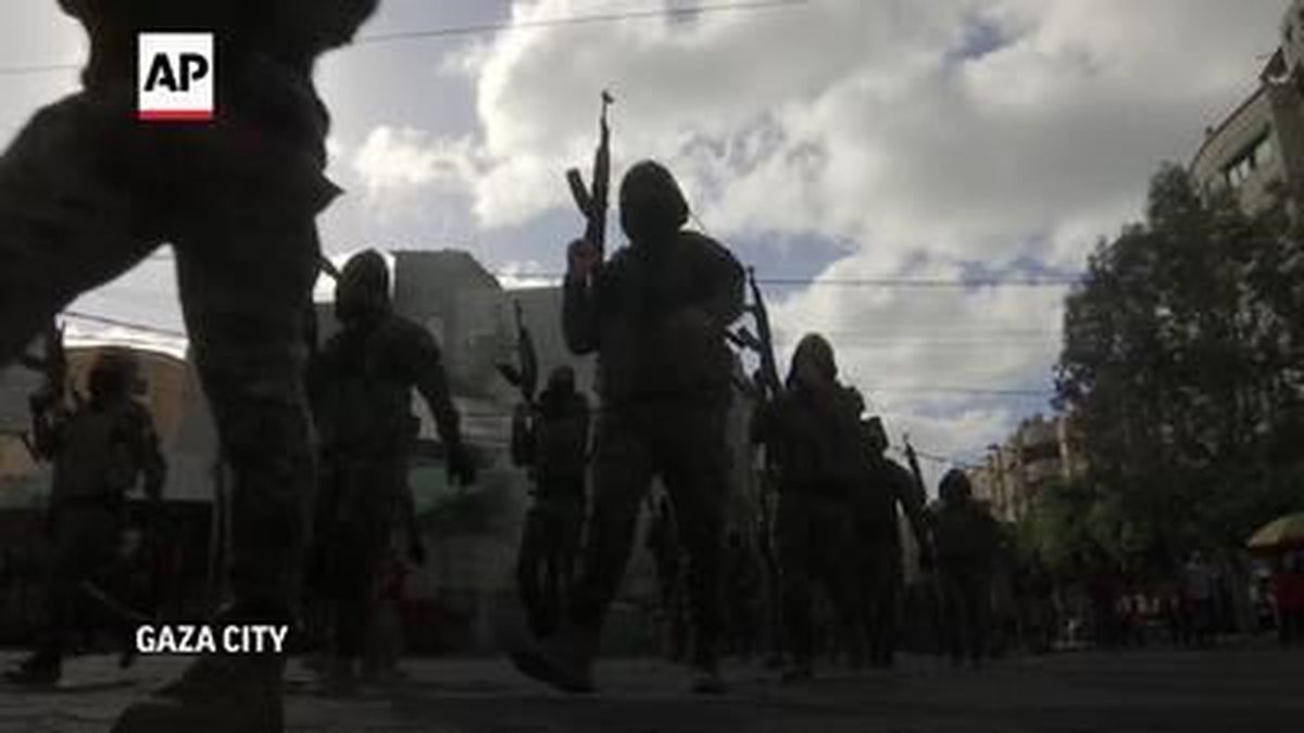 Hundreds of masked Hamas fighters brandishing assault rifles paraded in Gaza City on Saturday, in a defiant show of strength after the militants
