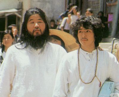 Cult guru Shoko Asahara, left, of Aum Shinrikyo walks with Yoshihiro Inoue, then a close aid, walk through Tokyo in this undated photo. Japanese media reports say on Friday, July 6, 2018, Asahara, who has been on death row for masterminding the 1995 deadly Tokyo subway gassing and other crimes, has been executed. He was 63. (AP)