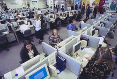 
Workers at the Melaleuca call center answer phones at their office in Rexburg, Idaho, in this February 2001 photo. Employers including Melaleuca, online auction house eBay, the FBI, and eye-care company 1-800 Contacts are capitalizing on the language skills required for the Church of Jesus Christ of Latter-day Saints' far-flung evangelism. 
 (File/Associated Press / The Spokesman-Review)