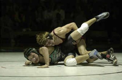 
University's Jeremy Montang gains the upper hand on East Valley's Brice Parker in the 140-pound weight class. 
 (Liz Kishimoto / The Spokesman-Review)