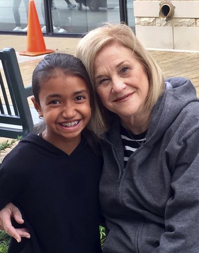 In this undated photo released by Brooke Pallot, Miami evacuee Sora Pallot poses for a photograph with her grandmother Suzanne Pallot. (Brooke Pallot / Associated Press)