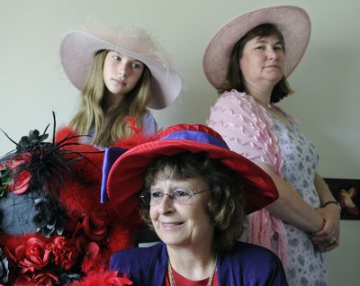 Jill Weiszman, center, is the Queen Mum of the Red Hat Society in Cheney. Felicia Ford, left, and her mother, Lynda Ford, are also members.  (Dan Pelle / The Spokesman-Review)