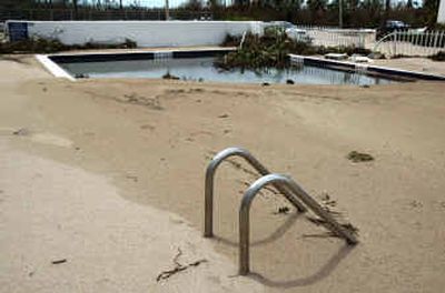 
A swimming pool at a condominium on Hutchinson Island, Fla. is shown filled with sand in the wake of Hurricane Frances in this Sept. 6 photo. 
 (File/Associated Press / The Spokesman-Review)