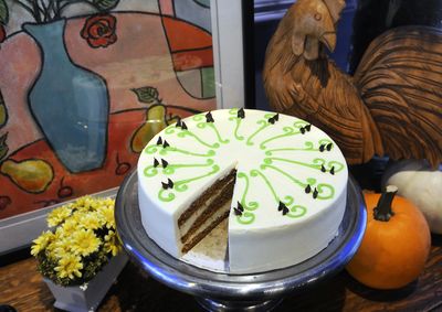 Cream cheese filling and frosting finish off a Pumpkin Spice Cake by Jan Peugh of Madeleine’s in downtown Spokane.  (Dan Pelle / The Spokesman-Review)