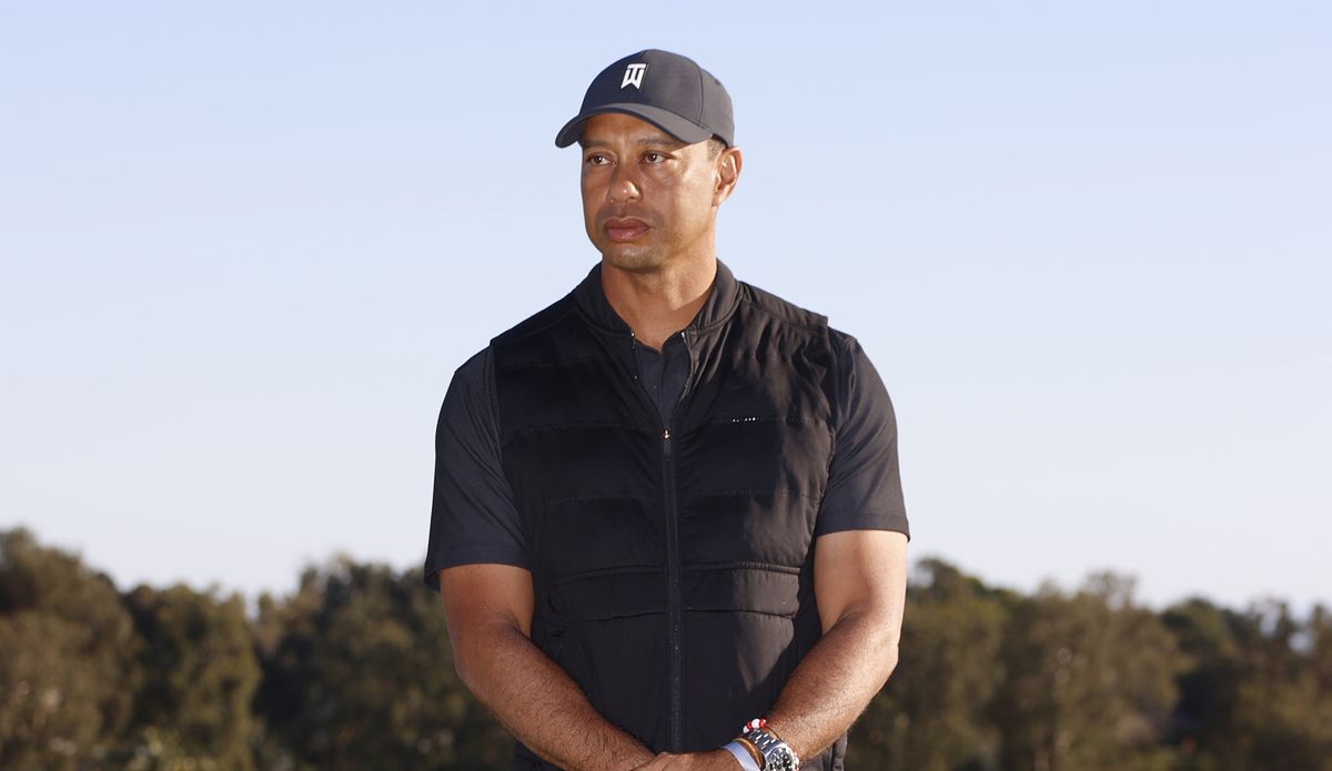 Tiger Woods looks on during the trophy ceremony on the practice green after the final round of the Genesis Invitational golf tournament at Riviera Country Club, Sunday, Feb. 21, 2021, in the Pacific Palisades area of Los Angeles.  (Ryan Kang)