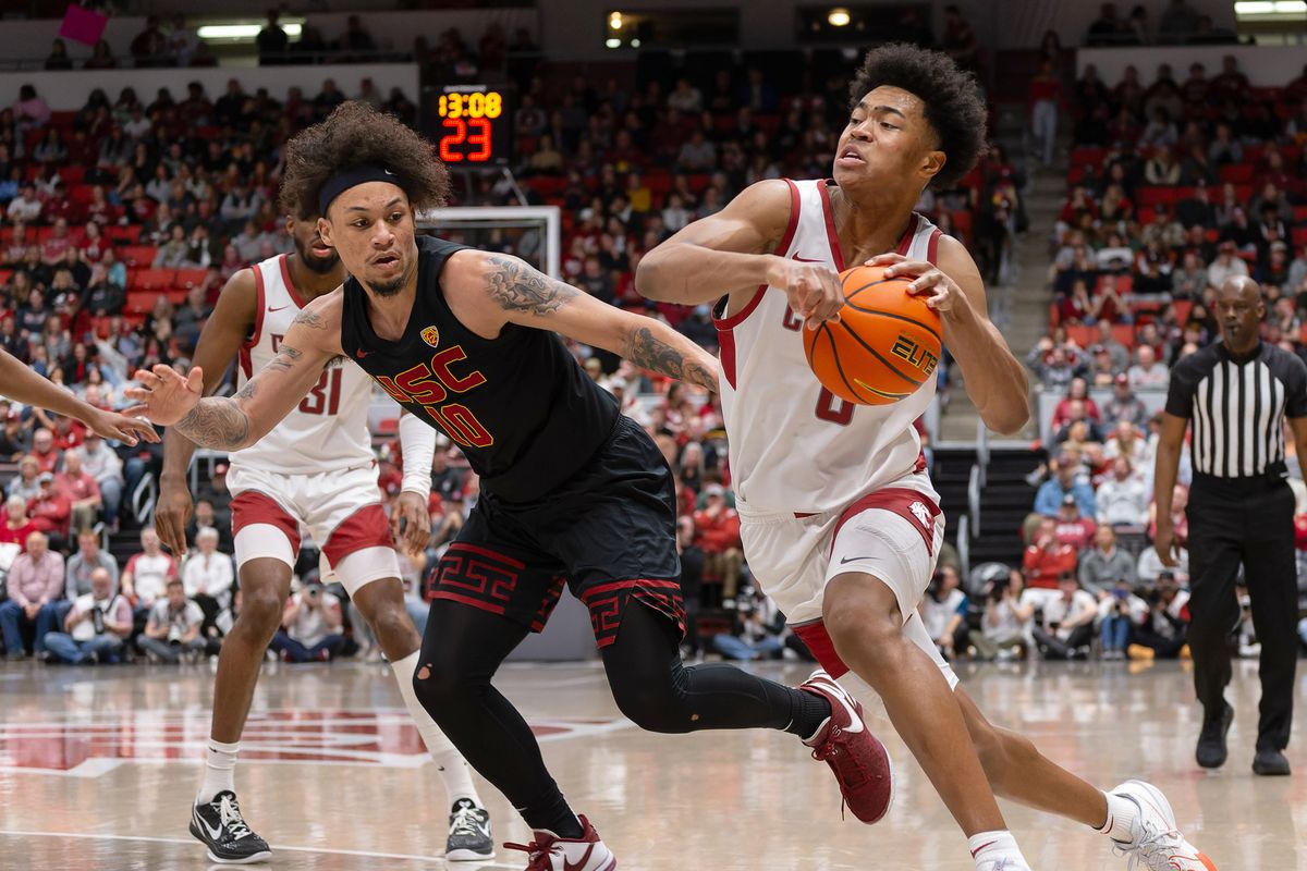 Washington State’s Jaylen Wells drives around USC’s DJ Rodman during the first half Thursday in Pullman.  (Geoff Crimmins/For The Spokesman-Review)