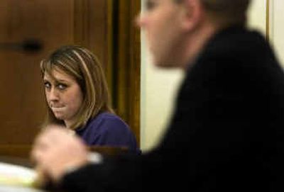 
During a mock trial between Ferris and Lewis and Clark high schools' legal studies classes, Lewis and Clark senior Bryce Bohlen, left, takes the witness stand. 
 (Colin Mulvany / The Spokesman-Review)