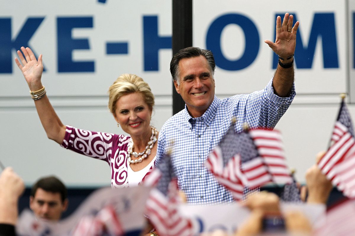 Republican presidential candidate and former Massachusetts Gov. Mitt Romney, right, waves as he arrives with his wife Ann at a campaign rally, Sunday, Oct. 7, 2012, in Port St. Lucie, Fla. (Lynne Sladky / Associated Press)