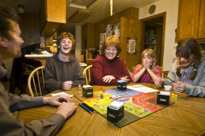 The Wordelman family plays a board game as a cheaper alternative to other family activities in Foresthill, Calif. McClatchy Tribune (McClatchy Tribune / The Spokesman-Review)