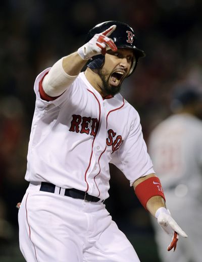 Shane Victorino celebrates after hitting a grand slam off an 0-2 pitch in the 7th inning. (Associated Press)