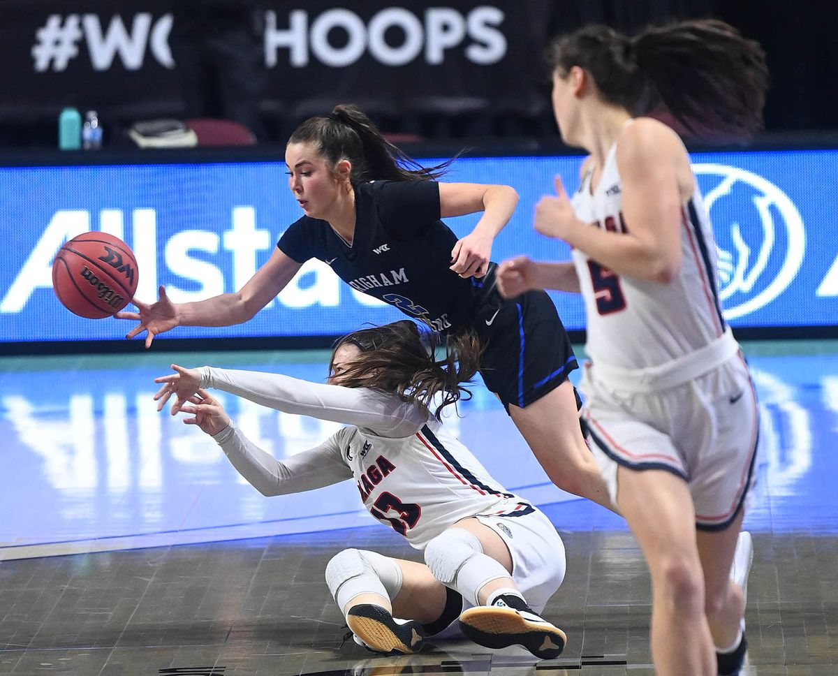 Gonzaga guard Cierra Walker (13) and BYU guard Shaylee Gonzales (2) chase a loose ball during the first half of a West Coast Conference Tournament final NCAA college basketball game, Tuesday, March 9, 2021, at the Orleans Arena in Las Vegas.  (COLIN MULVANY/THE SPOKESMAN-REVIEW)
