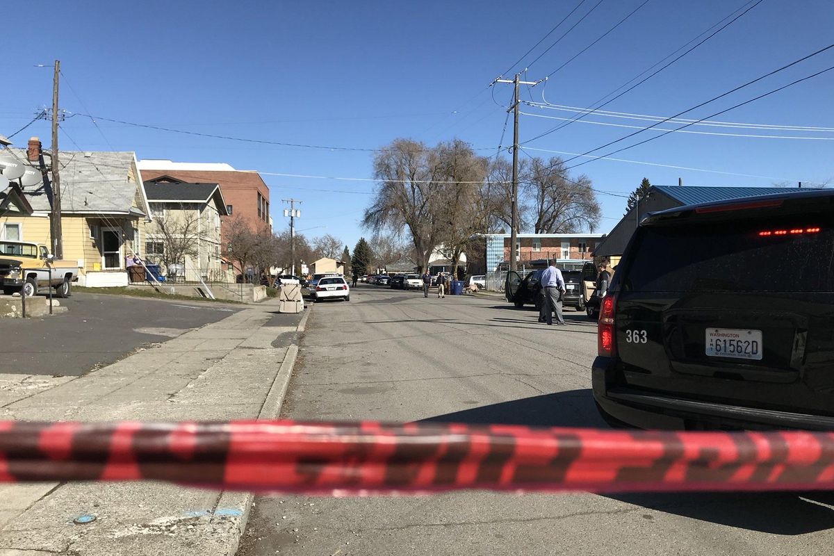 Crime scene tape marks off the area near the scene of an officer-involved shooting on March 12, 2018 in Spokane. (Jonathan Glover / The Spokesman-Review)