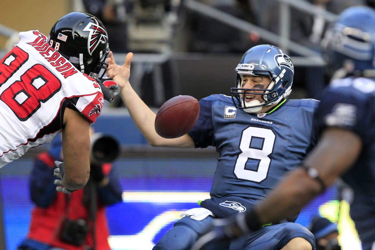 Matt Hasselbeck fumbles after being hit by Atlanta’s Jamaal Anderson in the end zone. The Falcons recovered for a touchdown. (Associated Press)