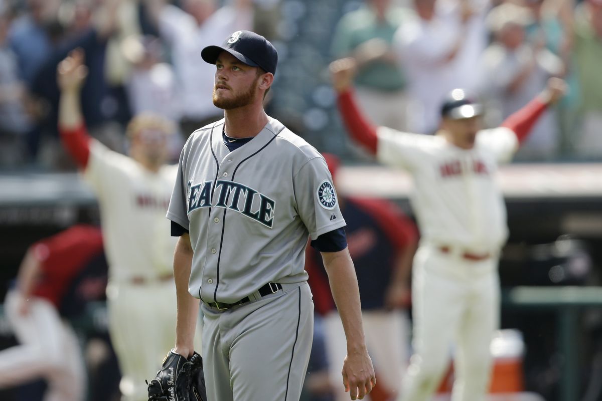 Mariners reliever Charlie Furbush walks off the field after giving up Yan Gomes’ walk-off homer. (Associated Press)