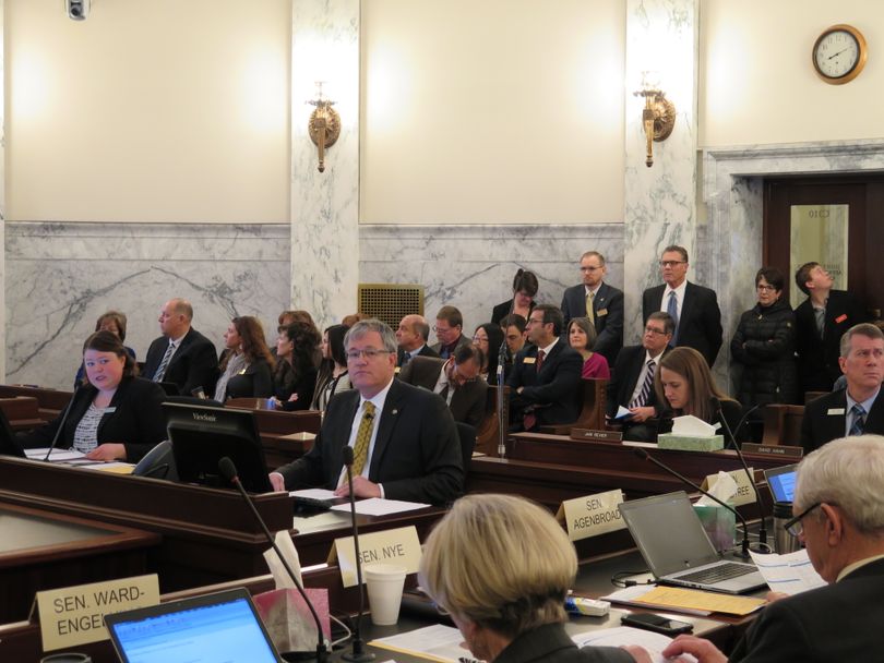 University of Idaho President Chuck Staben, center, at his budget hearing Wednesday morning before the Idaho Legislature's Joint Finance-Appropriations Committee. At left is budget analyst Janet Jessup. Under JFAC's new budget hearing format, agency heads and analysts take turns presenting budget information to the joint committee. (Betsy Z. Russell)