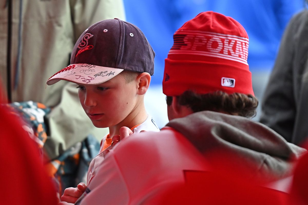 Spokane Indians fan Liam Terry, 8 years-old, gets hi shirt signed by Spokane Indians pitcher Hunter Omlid during the Community Fan Fest courtesy of Avista on Tuesday, April. 2, 2025 at Avista Stadium in Spokane WA.  (James Snook/For The Spokesman-Review)
