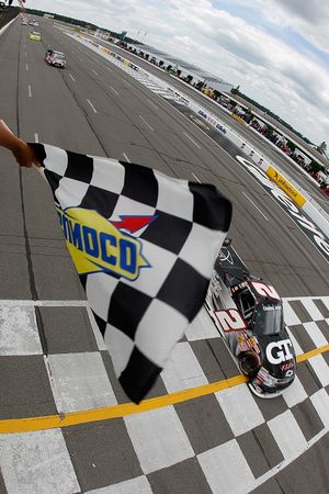 Elliott Sadler takes the checkered flag in the inaugural Pocono Mountains 125 at Pocono Raceway in Long Pond, Pa. (Photo courtesy of Todd Warshaw/Getty Images for NASCAR) (Todd Warshaw / Getty Images North America)