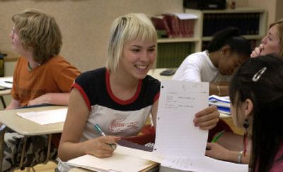 
Emma Ranniger compares answers with Larrissa Campbell on Tuesday at Lewis and Clark High School at a summer school program designed to help students pass the Washington Assessment of Student Learning. Sophomores who didn't pass all sections of the test the first time have until August to retake it.
 (Photos by Dan Pelle / The Spokesman-Review)