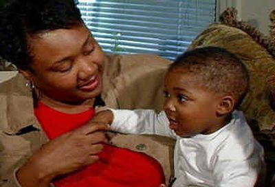 
Rubbie King plays with her nephew, Sterling Hafford, whose mother died. 
 (Associated Press / The Spokesman-Review)