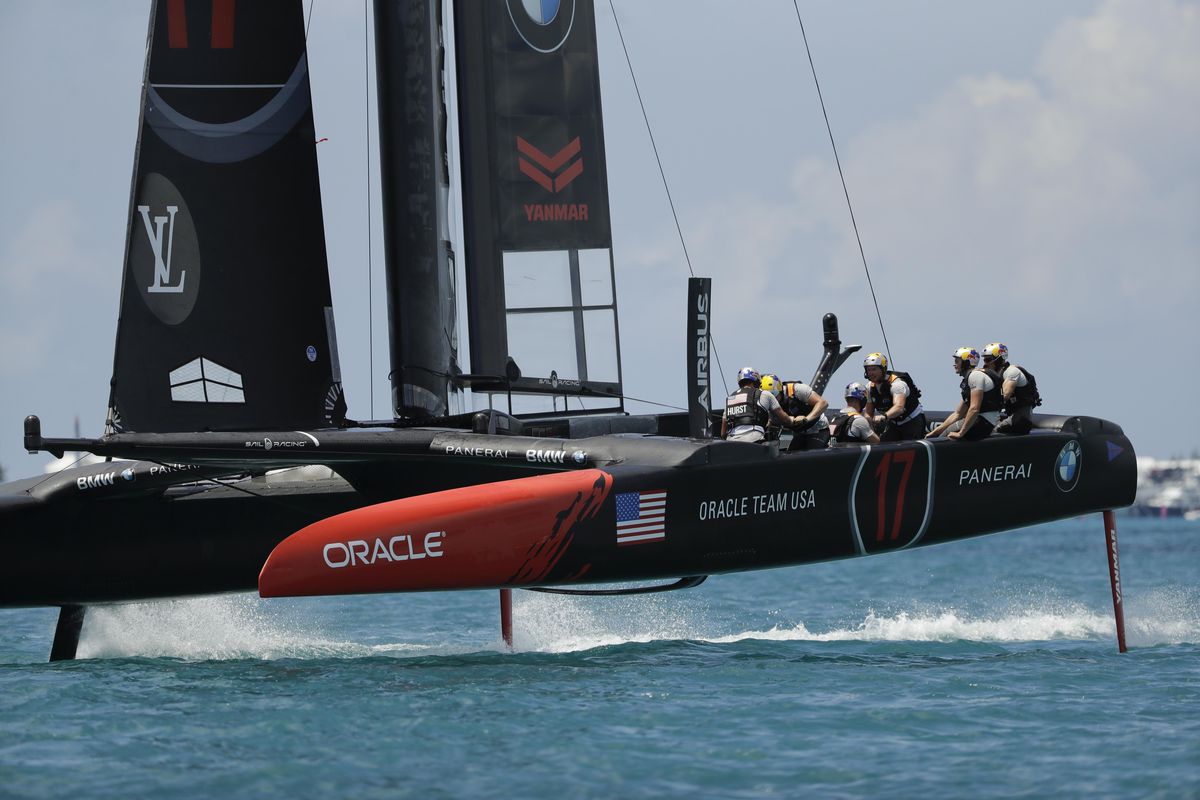Oracle Team USA races Emirates Team New Zealand during the first race of America’s Cup match sailing competition Saturday, June 17, 2017, in the Great Sound of Bermuda. (Gregory Bull / Associated Press)