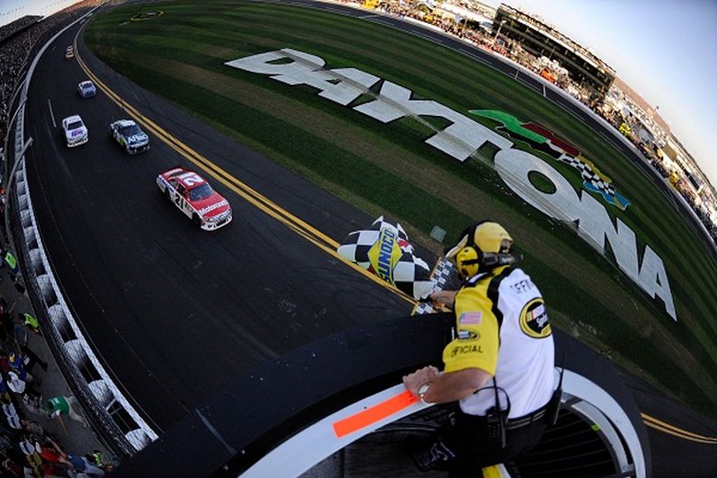 In only his second NASCAR Sprint Cup Series race, 20-year-old Trevor Bayne takes the checkered flag of the 2011 Daytona 500, becoming the youngest champion in the Great American Race's history on Sunday at Daytona International Speedway. (Photo Credit: Chris Graythen/Getty Images for NASCAR) (Chris Graythen / Getty Images North America)