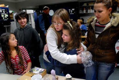 
Kayla Reedy, left, Bryce Decker, second from left, and translator Genta  Hysaj, far right, watch as Haileigh Rowley,  center standing, hugs Merita Ulaj during a goodbye party Monday in Dan Krotzer's sixth-grade classroom at Stevens Elementary in Spokane.  Special to the Spokesman-Review
 (INGRID BARRENTINE Special to the Spokesman-Review / The Spokesman-Review)