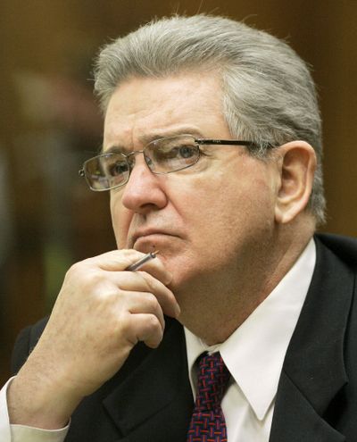 In this Oct. 15, 2008 photo, former FBI agent John Connolly listens to the testimony during his trial in Miami. The imprisoned former FBI agent serving a 40-year prison sentence for alerting former Boston mobster Whitey Bulger that he could implicated in a mob murder wants to be released from prison on medical grounds. Connolly will ask the Florida Commission on Offender Review Wednesday, Feb. 17, 2021 to release him.  (Alan Diaz)