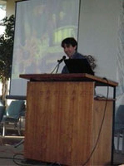 Jeremy Smith speaks to a crowd of approximately 150 citizens about creating a healthier, more affordable, locally-based food system.  (Julie Schaffer / Down to Earth NW Correspondent)