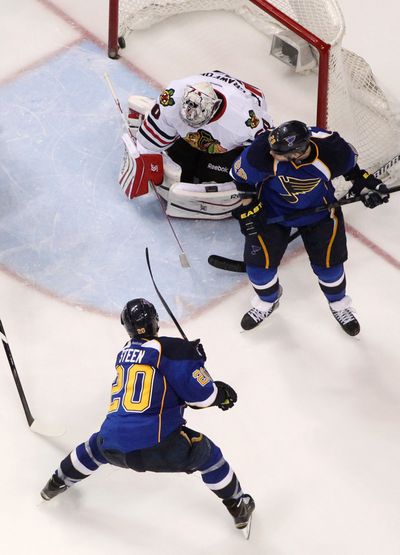 Blues left wing Alexander Steen scores the winning goal past Chicago’s Corey Crawford 26 seconds into the third overtime. (Associated Press)