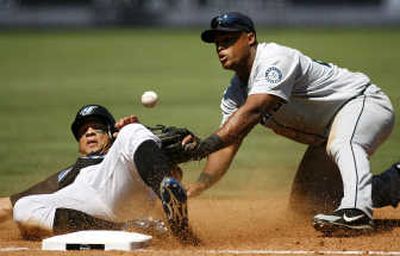 
Toronto's Royce Clayton slides safely into third in front of Seattle's Adrian Beltre.Associated Press
 (Associated Press / The Spokesman-Review)