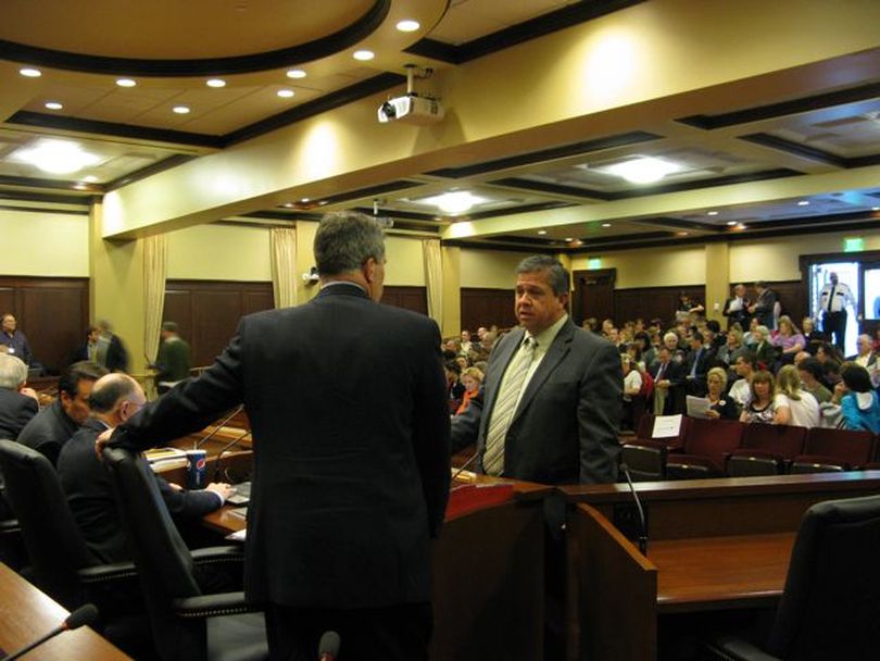 State Superintendent of Schools Tom Luna talks with Sen. Mitch Toryanski, R-Boise, before the start of Tuesday's school reform hearing, which drew a full house. (Betsy Russell)