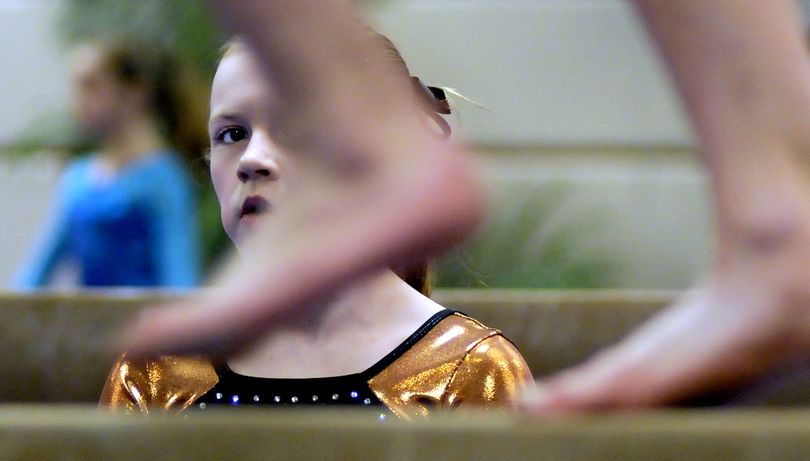 Nicole Turner, 12, of Velocity Gymnastics out of Hamilton Montana kept an eye on the competition during Great West Gym Fest at the Coeur d'Alene Resort on Friday, February 19, 2010. Several hundred gymnast are in town for the meet that runs through Sunday. (Kathy Plonka / The Spokesman-Review)