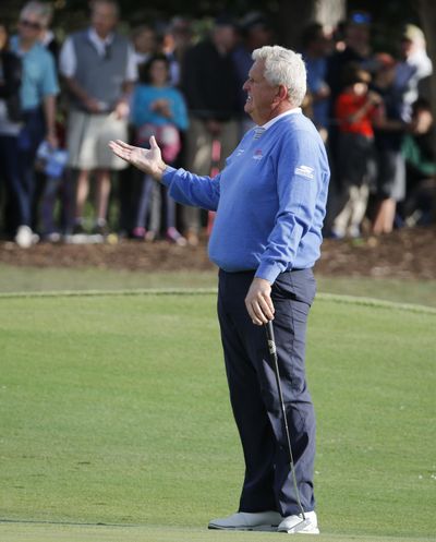 Colin Montgomerie gestures to noisy fans in the stands on the finishing hole during the second round of the PGA Tour Champions' Dominion Energy Charity Classic golf tournament in Richmond, Va., on October 19. (JOE MAHONEY / Associated Press)