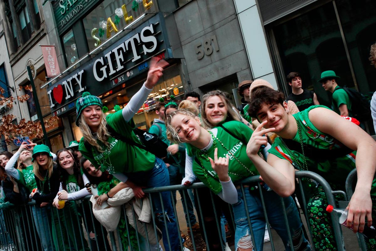People wait at Fifth Avenue the start of the St. Patrick