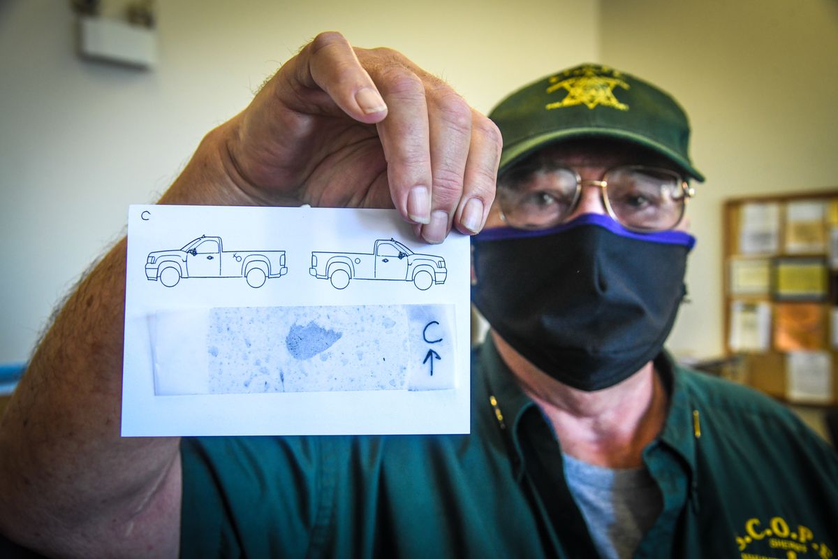 S.C.O.P.E. volunteer Todd Beese shows a potential latent fingerprint, Monday, July 27, 2020, in Spokane Valley, Wash. The smudge was lifted from a burglarized 2015 Dodge Ram truck,  (DAN PELLE/THE SPOKESMAN-REVIEW)